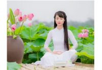 The full lotus position is a good for achieving trance in meditation, and according to traditional Chinese medicine, helps revitalize the body. Here, a woman demonstrates the sitting meditation in the spiritual practice of Falun Dafa.