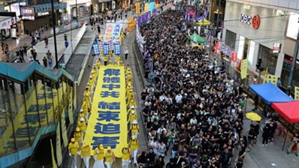 Falun Gong practitioners hold a parade on July 1, 2019, in Hong Kong. 